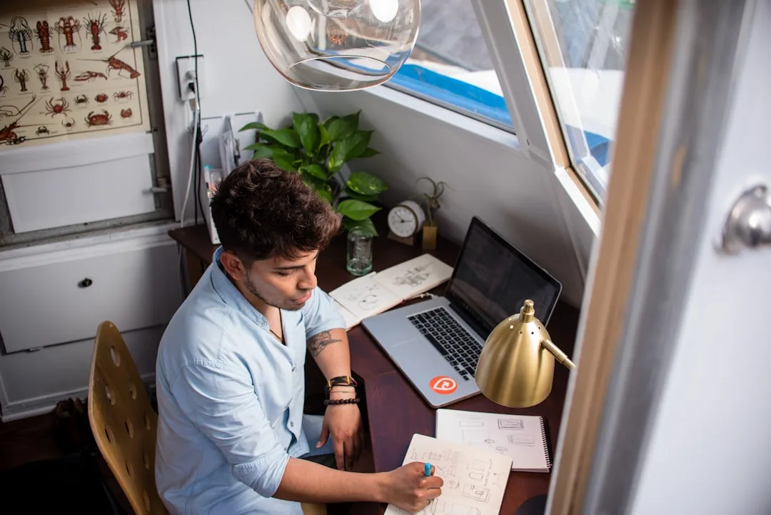 New UK contractor at a desk working through a first-year setup and compliance checklist