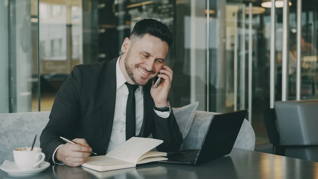 Person at a desk completing a UK Self Assessment tax return on a laptop