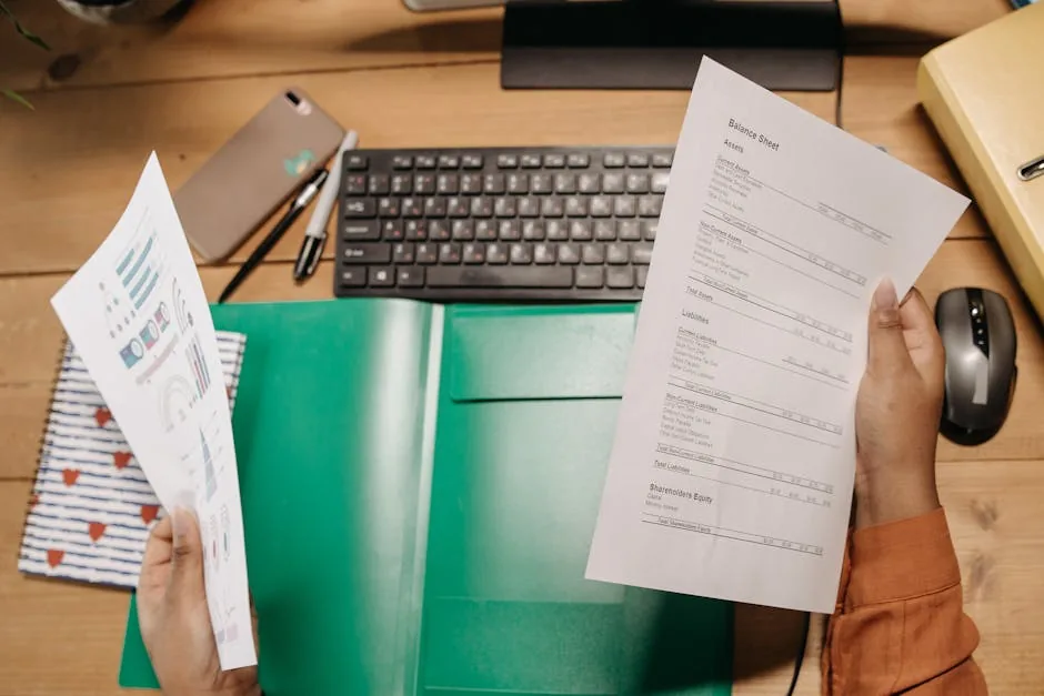 A UK employee checking the tax code on a payslip at a kitchen table