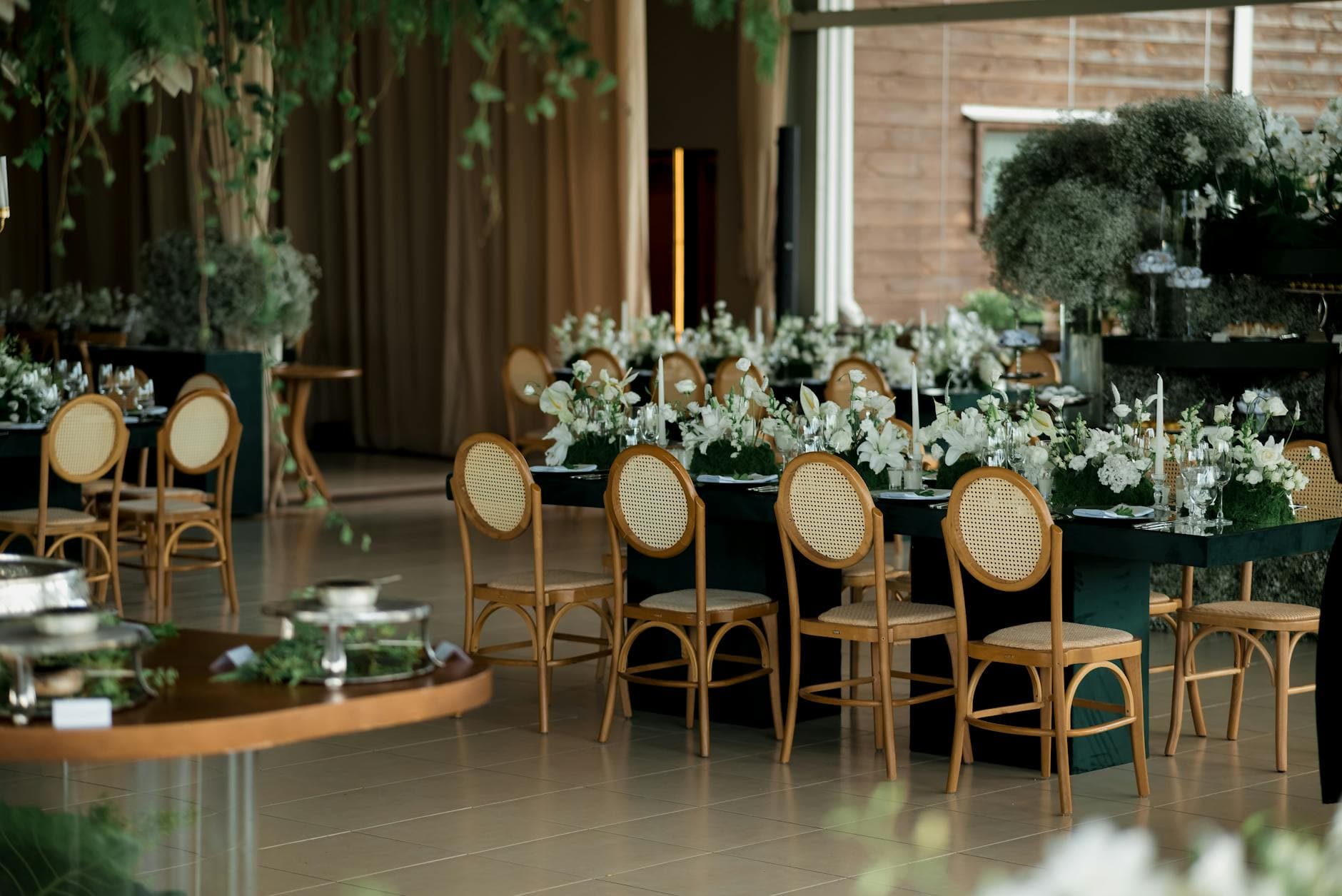 Elegant wedding reception table setting with white florals