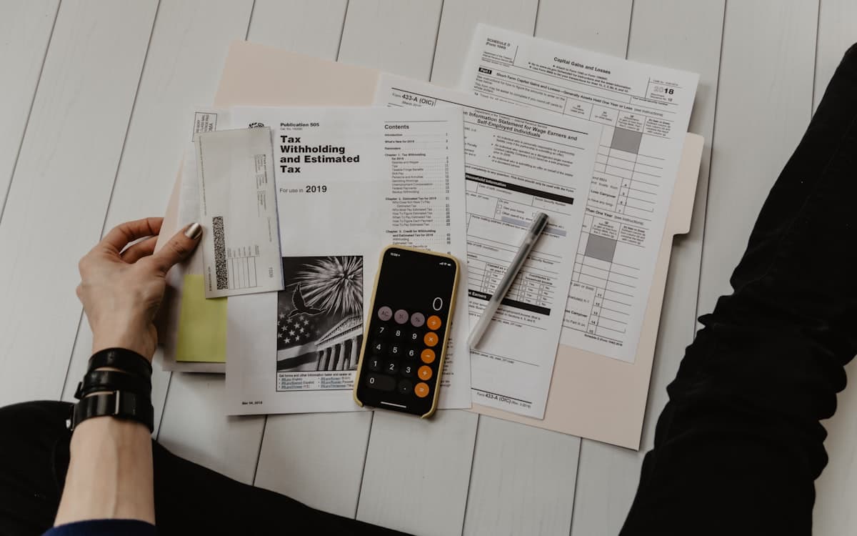 Calculator and tax forms on a desk