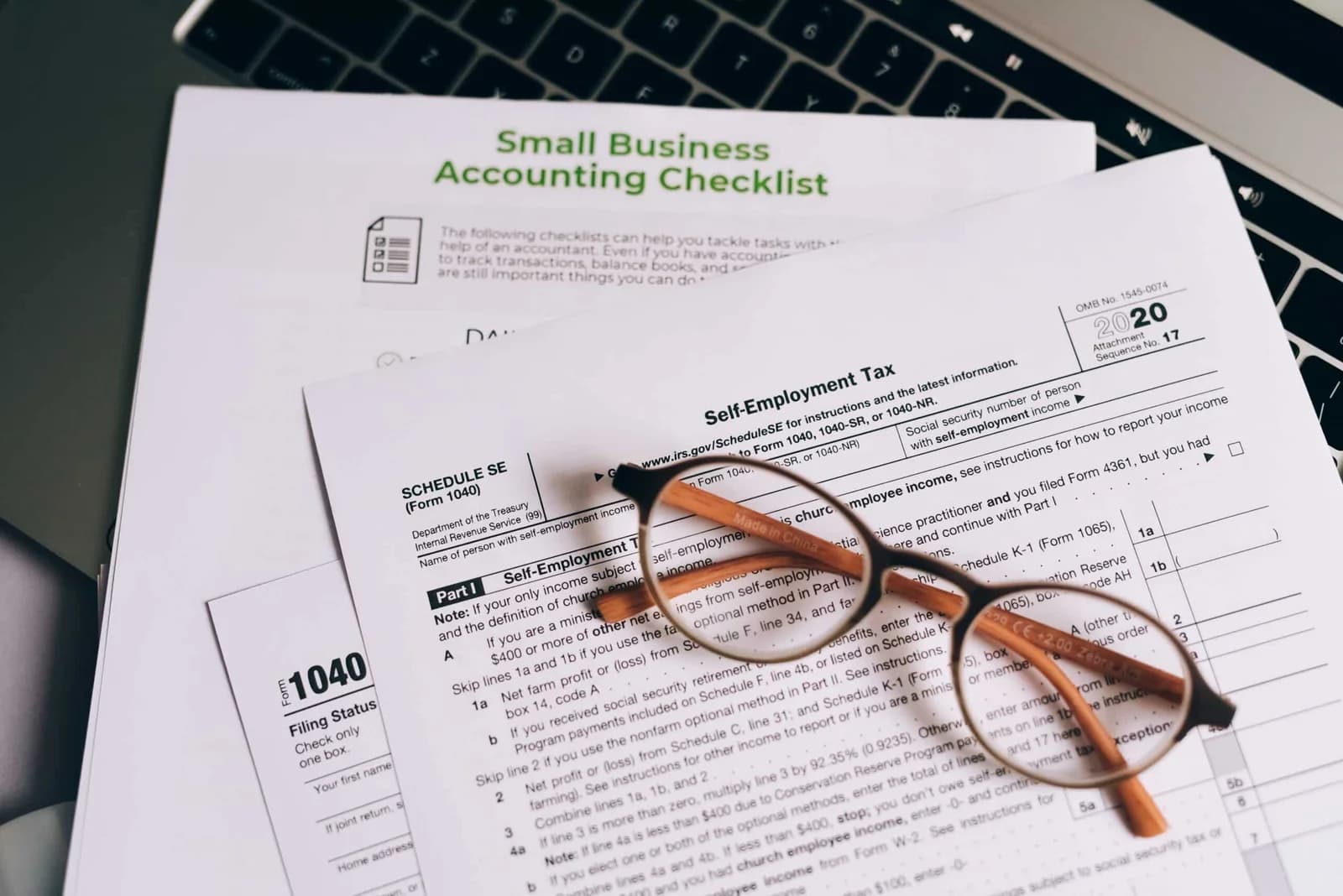 A close-up of small business accounting checklist with documents.