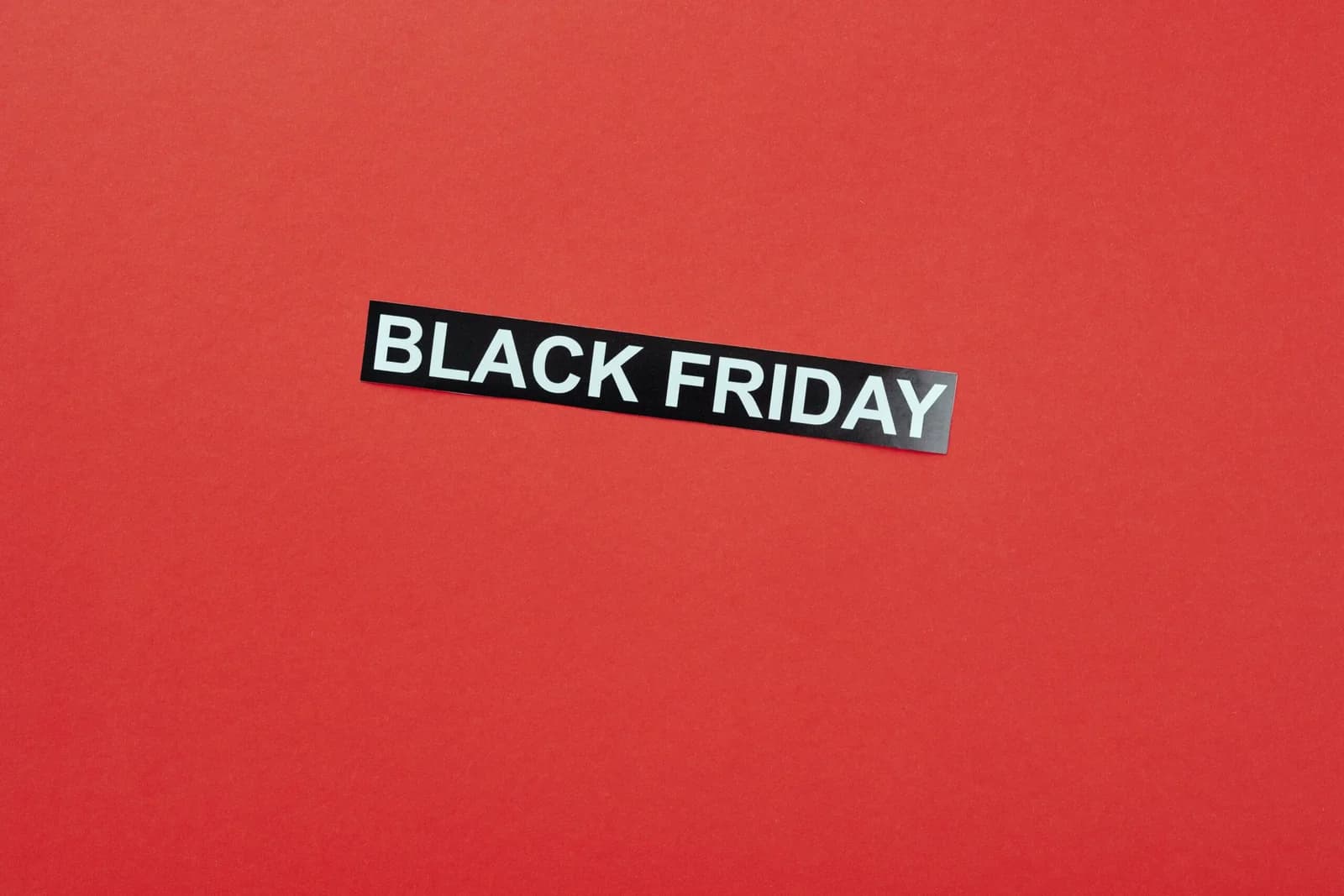 A "Black Friday" sale sign on a red background.