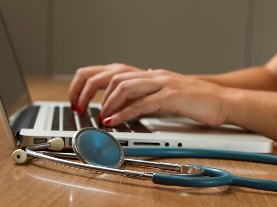 Doctor with stethoscope reviewing notes