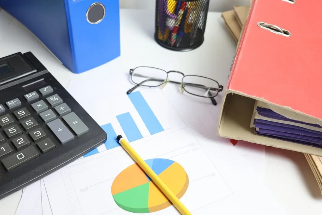 UK business owner comparing a wall planner and accounts to check their financial year dates