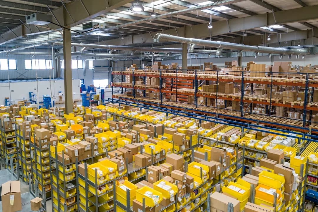 Amazon FBA seller reconciling refunds and returns in bookkeeping software at a desk