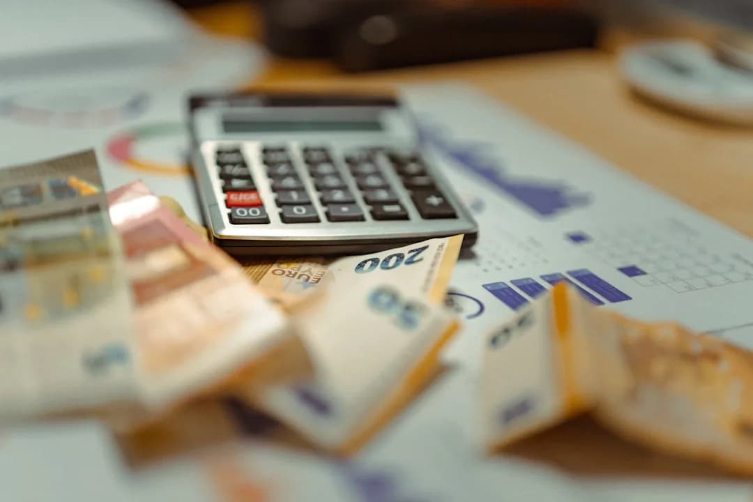 An Amazon FBA seller reconciling an inventory ledger on a laptop for a year-end stock count
