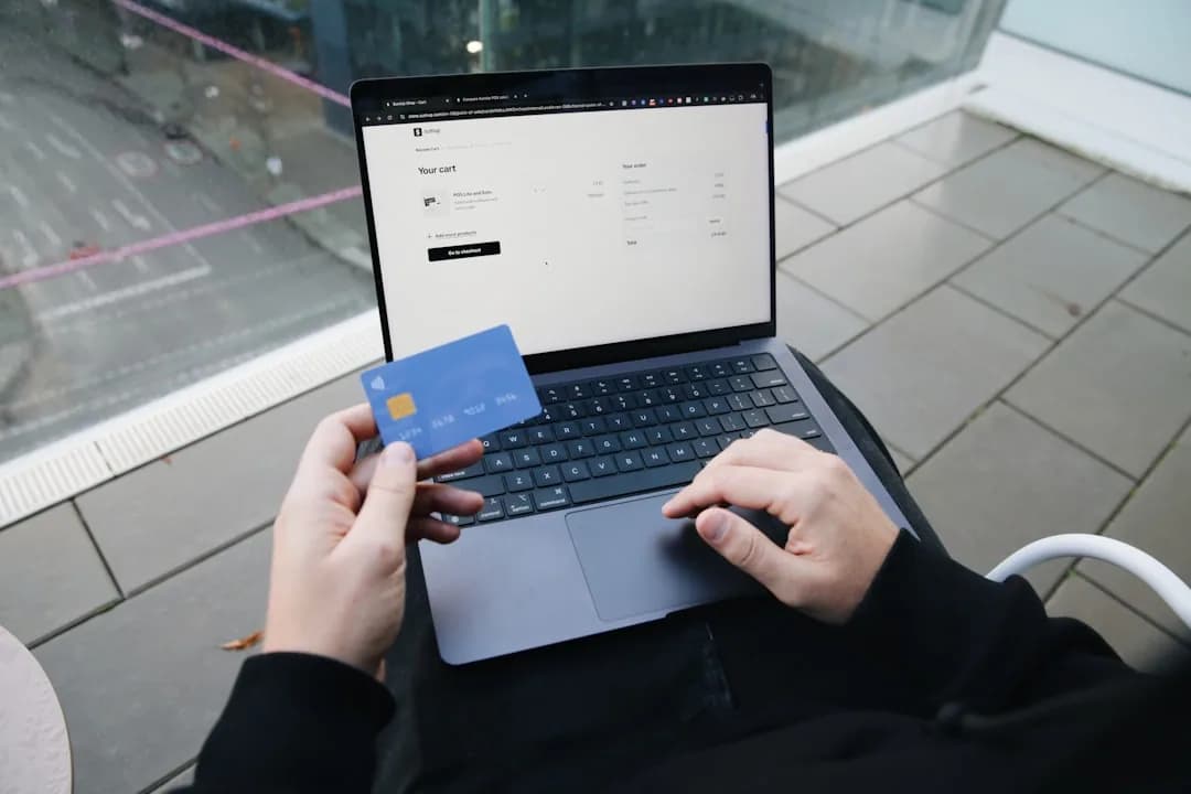 Amazon FBA seller reviewing a multi-currency payout statement and exchange rate on a laptop