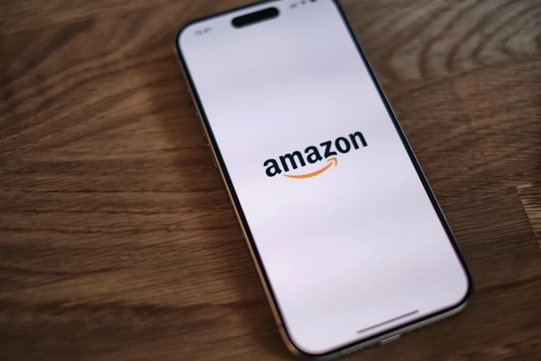 An Amazon seller reconciling a settlement payout to a clearing account in Xero on a laptop