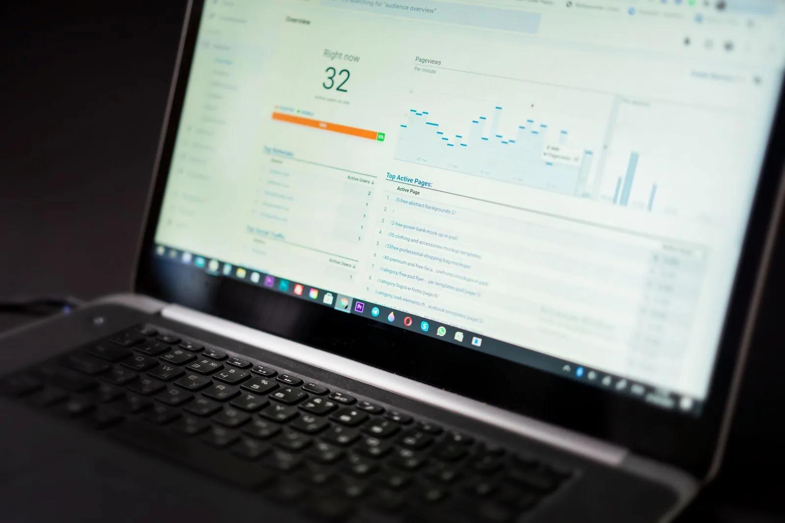 Laptop showing an accounting analytics dashboard with charts and key performance figures