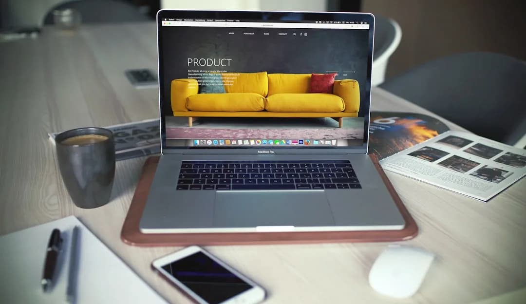A UK online seller reviewing marketplace payouts and a VAT return at a desk with a laptop