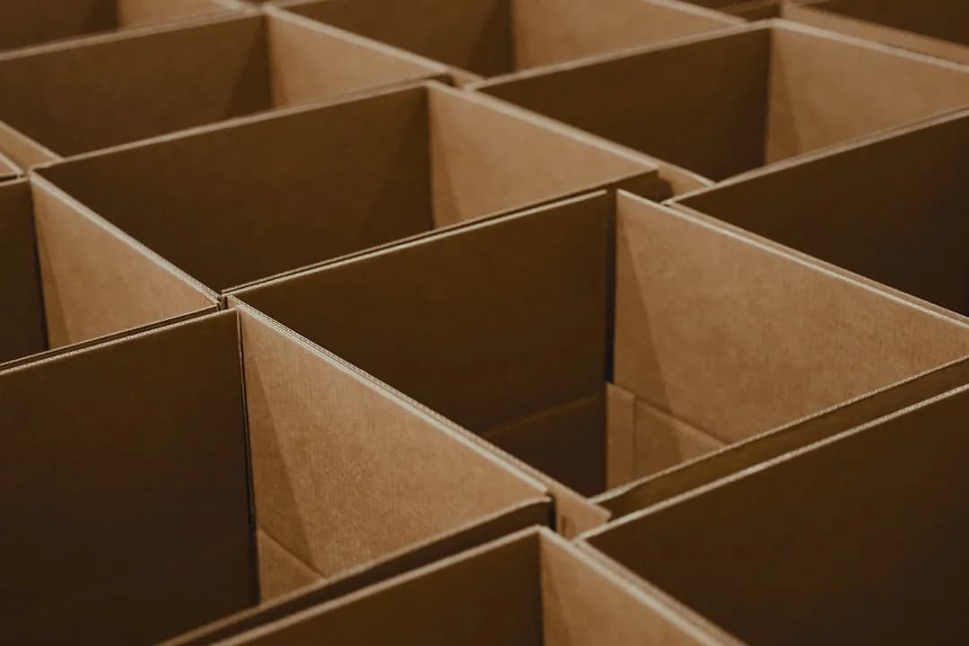 UK dropshipper at a laptop reviewing orders, VAT and import duty on store dashboards