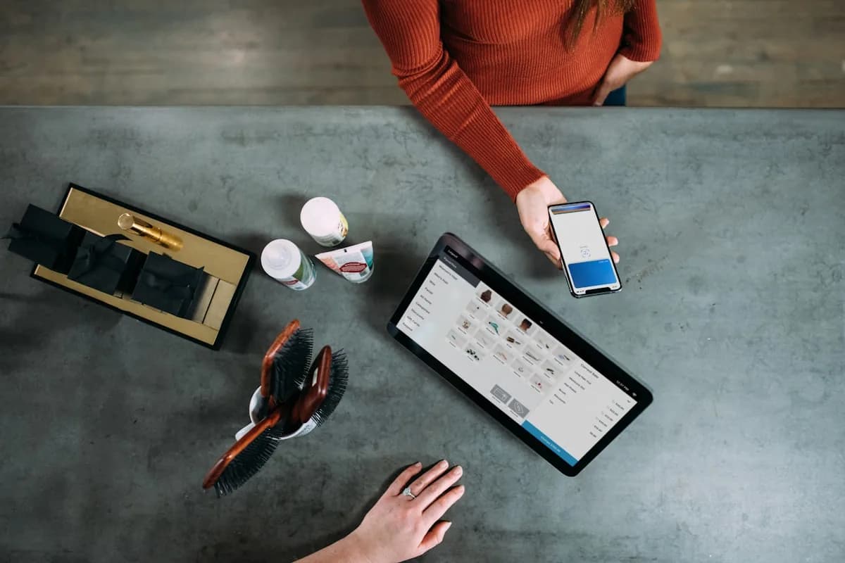 Ecommerce seller matching a marketplace payout statement to their sales records on a laptop