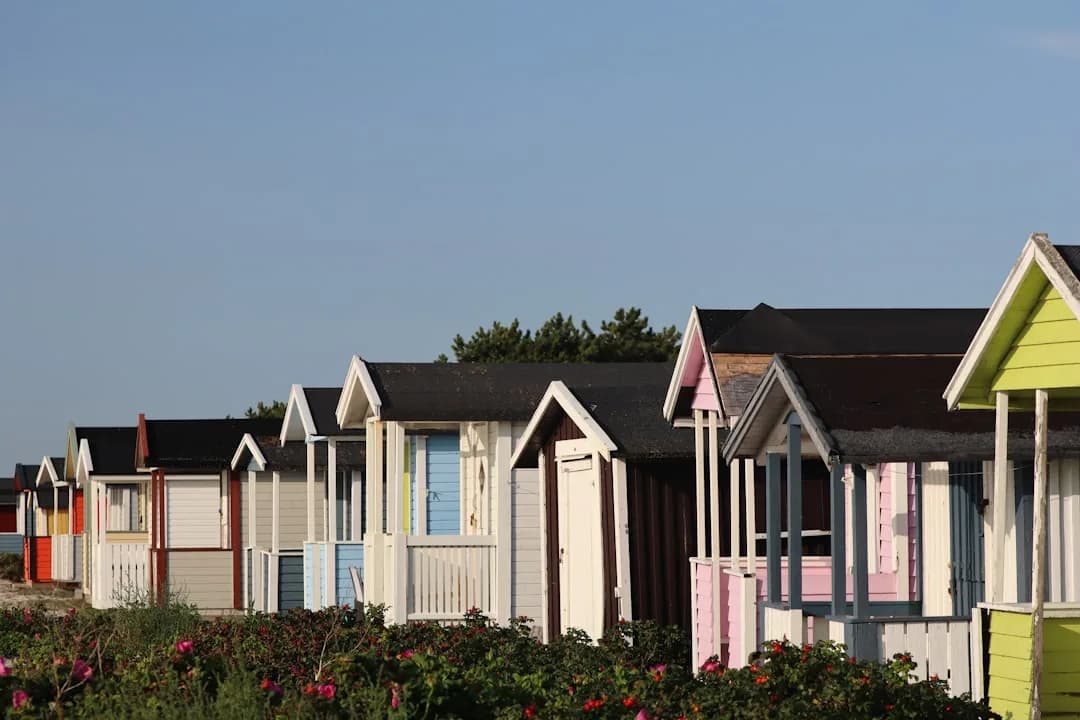 A holiday cottage owner reviewing rental accounts at a kitchen table to plan for tax changes