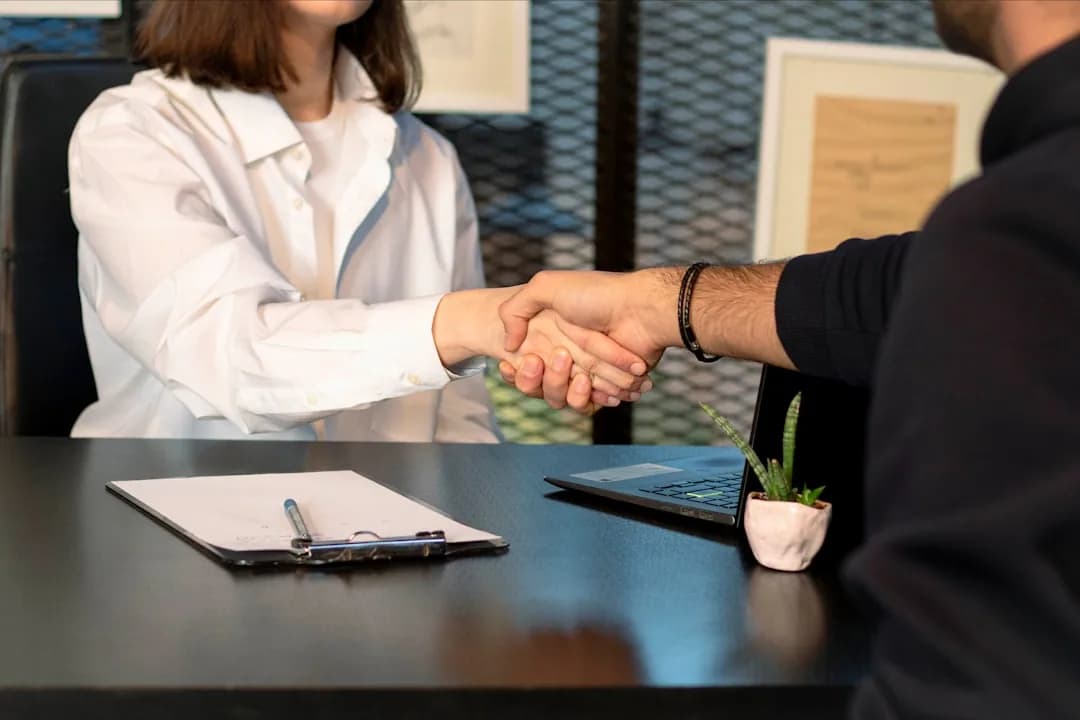 UK small business owner reviewing an employment contract for a new hire