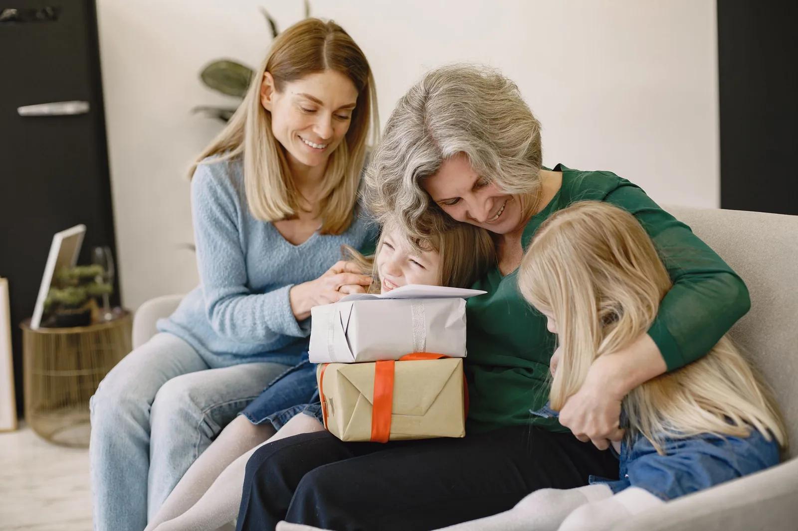 A grandparent handing a wrapped gift and cash to grandchildren at a family table, illustrating tax-free gifting