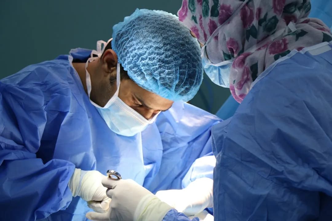 A dentist reviewing treatment plans at a UK practice reception to check which work is VAT exempt