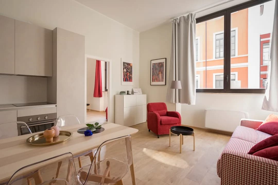 A homeowner showing a spare furnished bedroom to a prospective lodger in a UK home