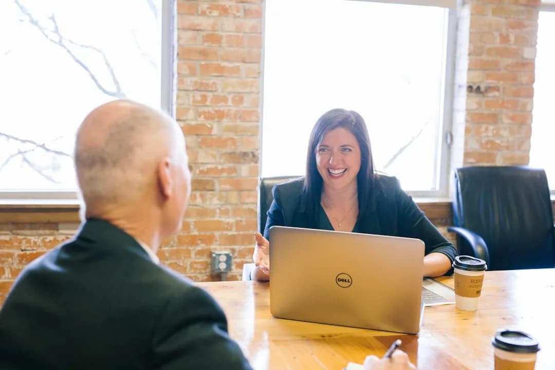 A UK Shopify seller checking a Shopify invoice against a VAT return on a laptop