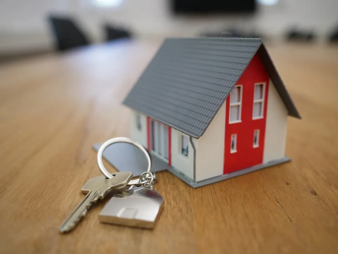UK landlord at a desk reviewing buy-to-let mortgage statements and a tax return