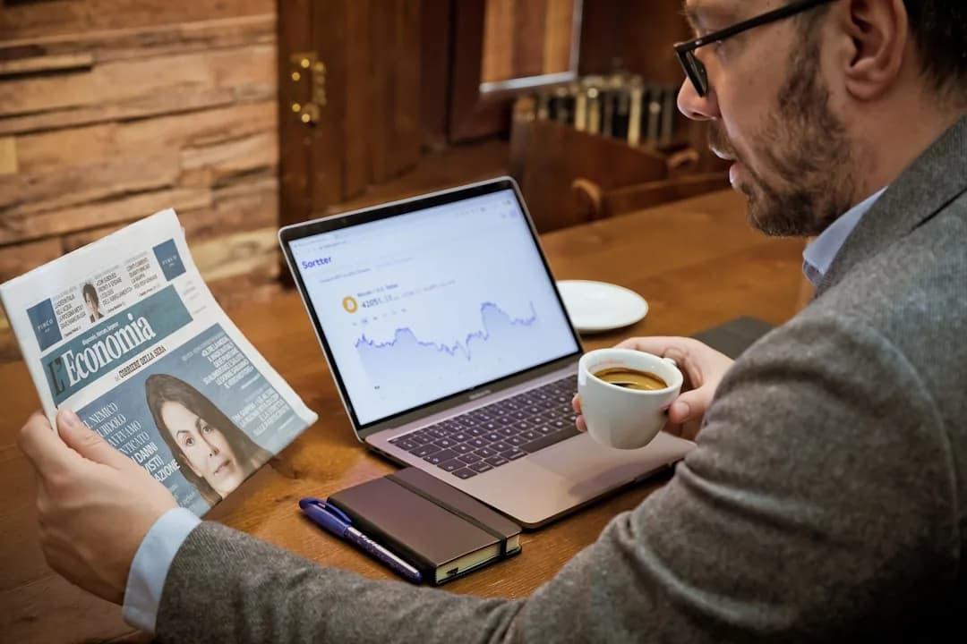 Self-employed UK tradesperson at a workbench reviewing figures to work out their tax bill