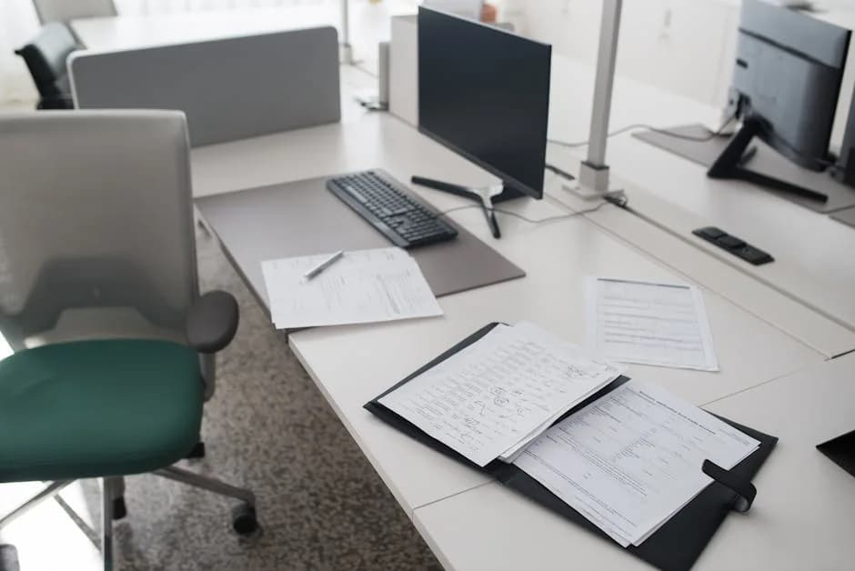 A UK Shopify dropshipper checking import VAT and EORI details on a laptop in a small home office