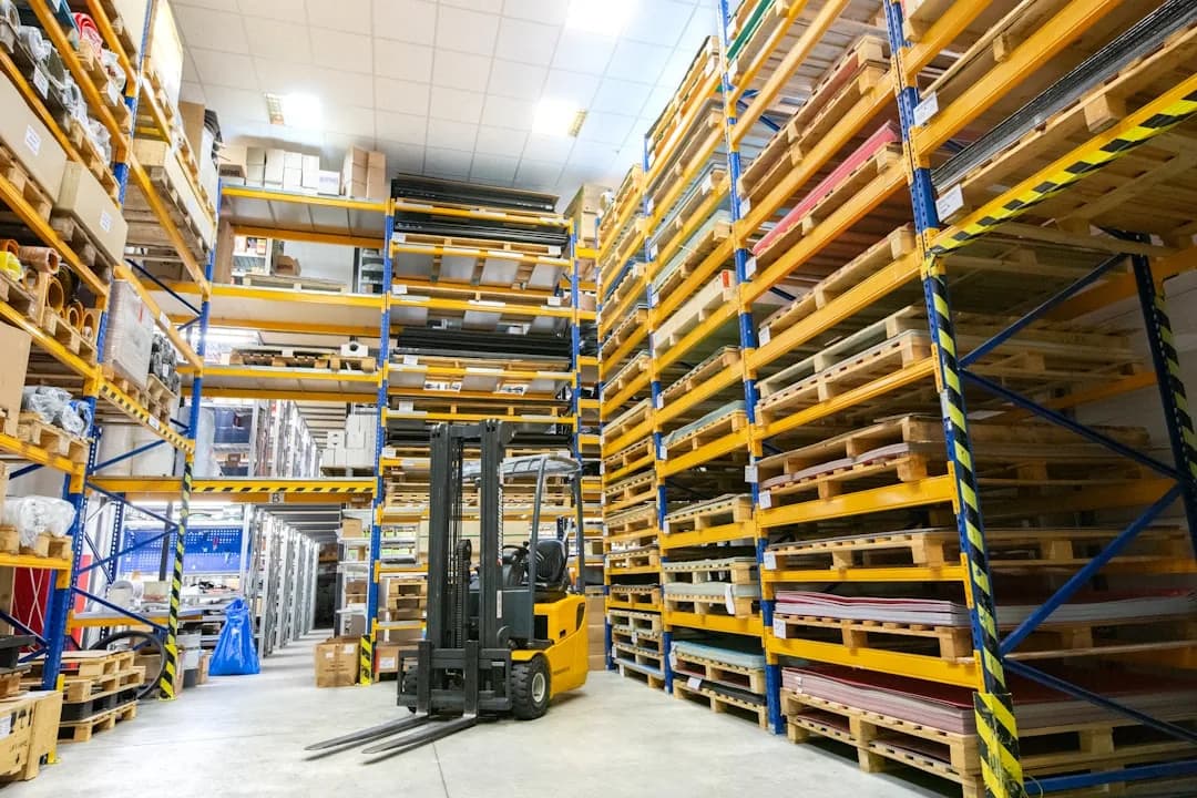 A Shopify seller checking stock in a UK fulfilment warehouse and reviewing VAT registration