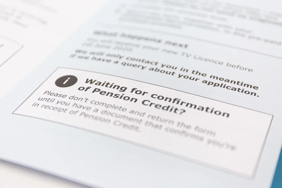 A UK contractor reviewing a client contract at a desk to check who decides IR35 status