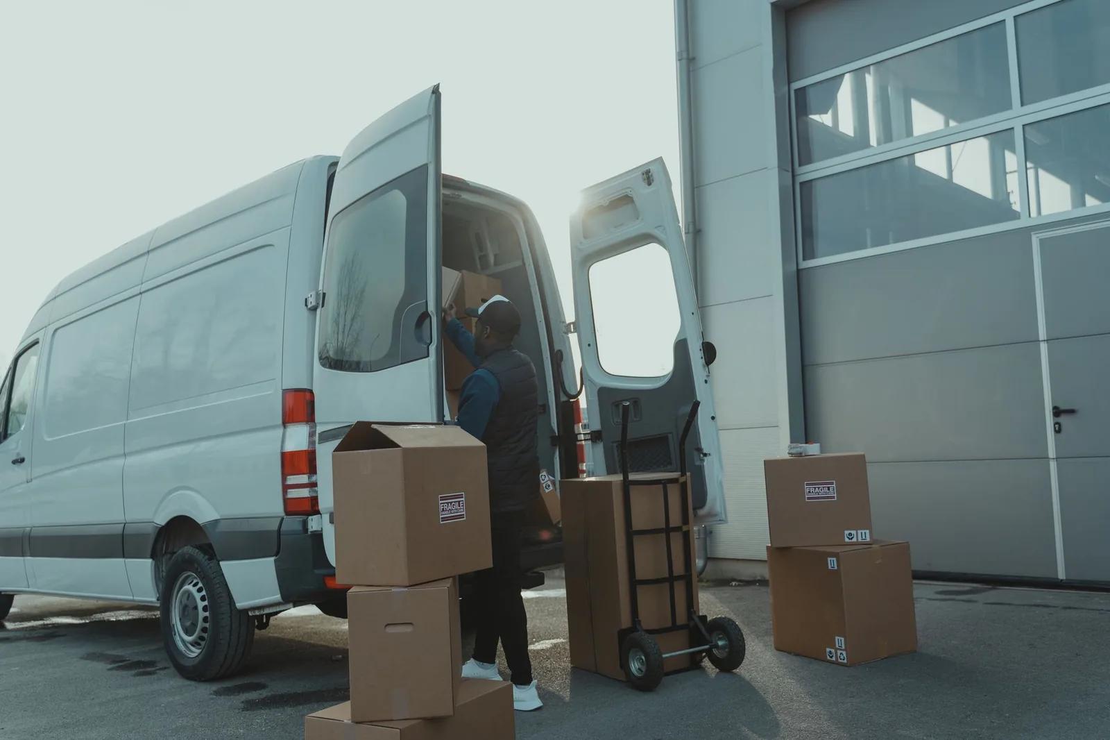 Delivery parcels and a van being loaded for shipping goods to Northern Ireland