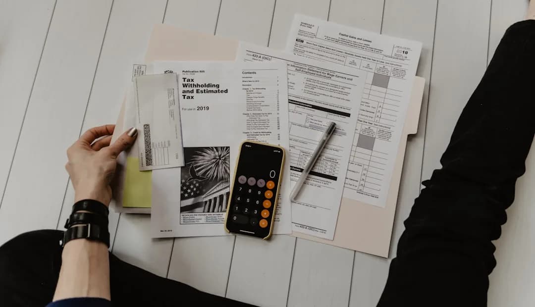 An eBay seller at a desk reviewing past sales records to make a voluntary disclosure to HMRC