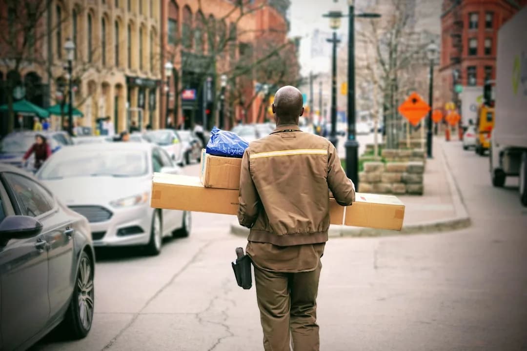 An Amazon FBA seller reviewing a VAT invoice and laptop to reclaim VAT on selling fees