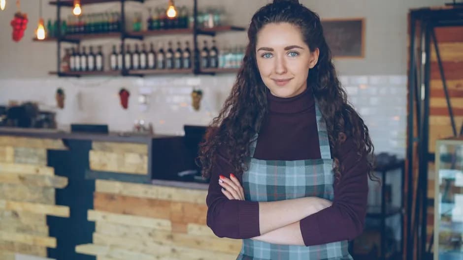 A self-employed business owner checking rolling 12-month turnover against the VAT threshold