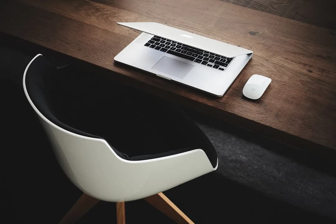 Ecommerce owner reviewing WooCommerce sales and VAT settings on a laptop at a desk