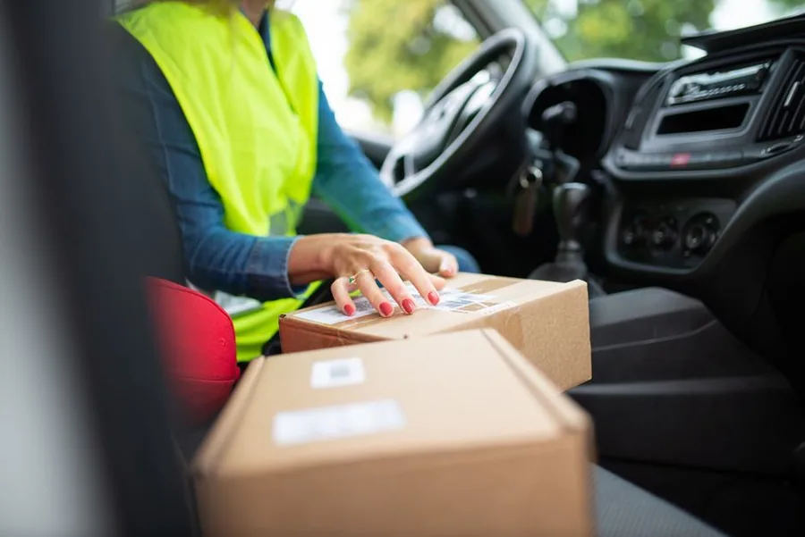 Labelled parcels loaded for cross-border dispatch, the low-value consignments the £135 import VAT rule covers Labelled parcels loaded for cross-border dispatch, the low-value consignments the £135 import VAT rule covers
