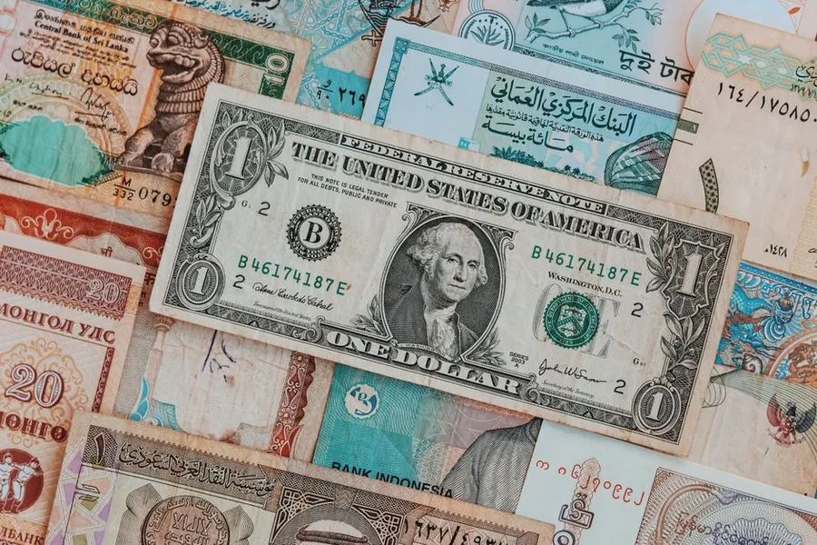 Banknotes from several countries spread out, reflecting the foreign exchange behind Amazon seller payouts Banknotes from several countries spread out, reflecting the foreign exchange behind Amazon seller payouts