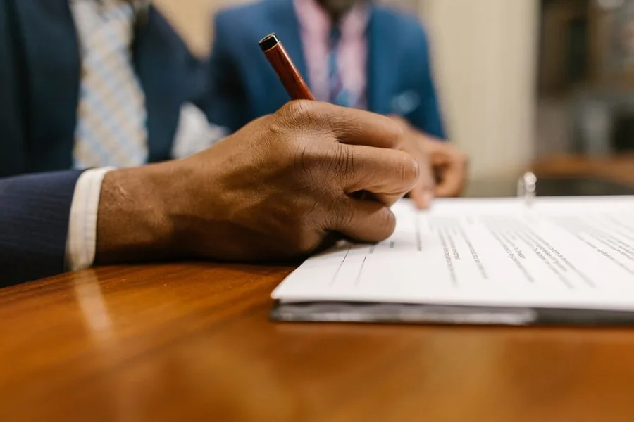 A UK business owner signing off accounts with an accountant to review the tax treatment of marketplace reimbursements A UK business owner signing off accounts with an accountant to review the tax treatment of marketplace reimbursements
