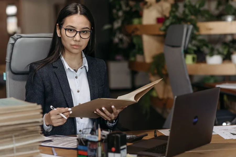 A self-employed childminder reviewing her income records ahead of Making Tax Digital quarterly updates
