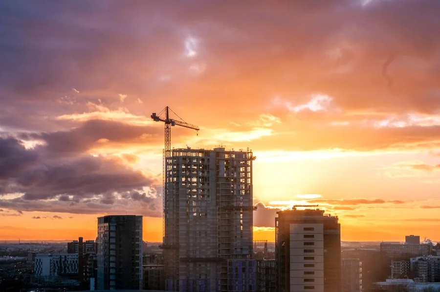 A tower crane over a part-built city tower block, the kind of construction project CIS subcontractors work on A tower crane over a part-built city tower block, the kind of construction project CIS subcontractors work on