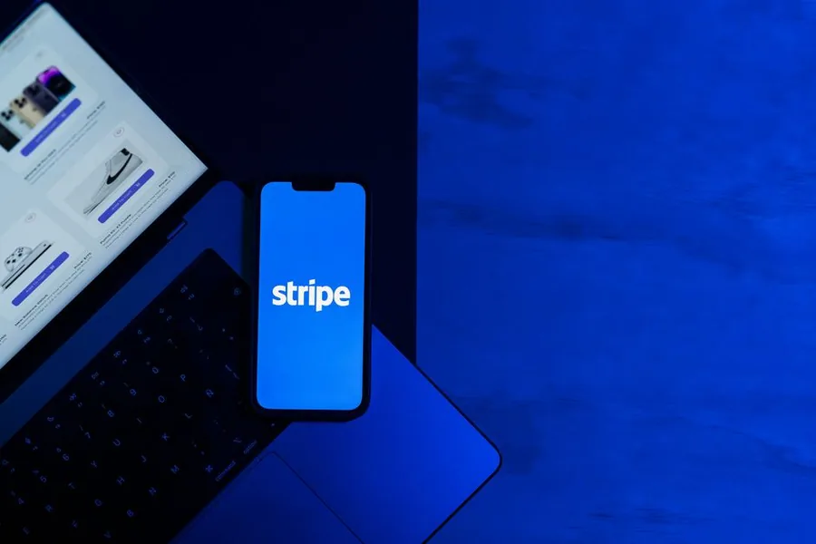 A Stripe payment app open on a phone beside an online store, the kind of sales data UK ecommerce sellers feed into cloud accounting software A Stripe payment app open on a phone beside an online store, the kind of sales data UK ecommerce sellers feed into cloud accounting software