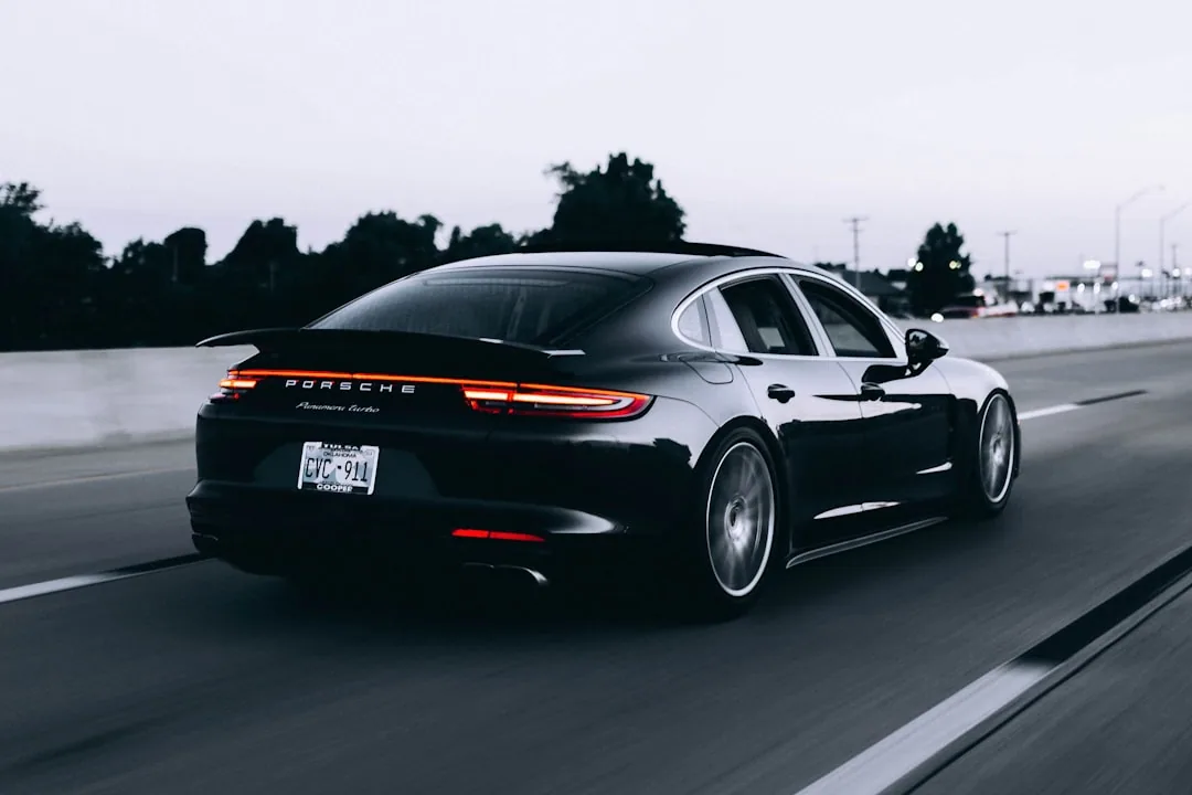 A company director comparing an electric car and a payslip to work out benefit in kind tax