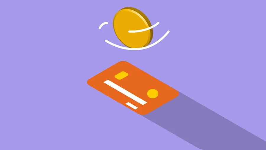 Several business payment cards fanned out on a desk, the kind of spending choices an ecommerce seller weighs up for expenses
