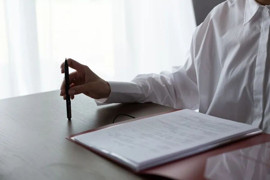 A landlord reviewing rental income paperwork before completing their Self Assessment tax return