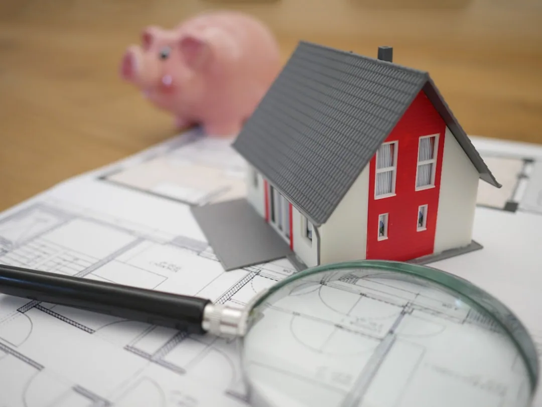 A UK landlord at a kitchen table sorting rental receipts to complete a Self Assessment tax return