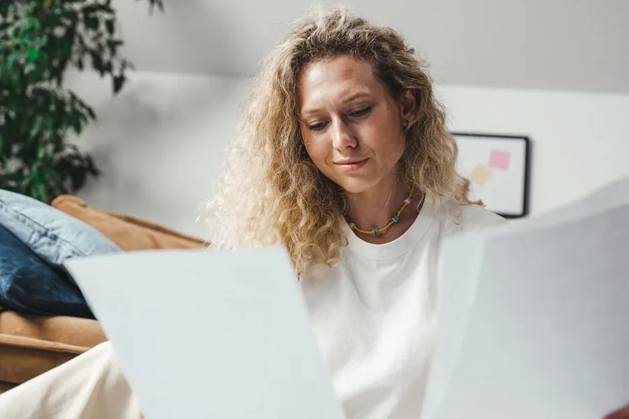 A UK taxpayer at home reviewing paperwork to work out whether they need to file a Self Assessment return A UK taxpayer at home reviewing paperwork to work out whether they need to file a Self Assessment return