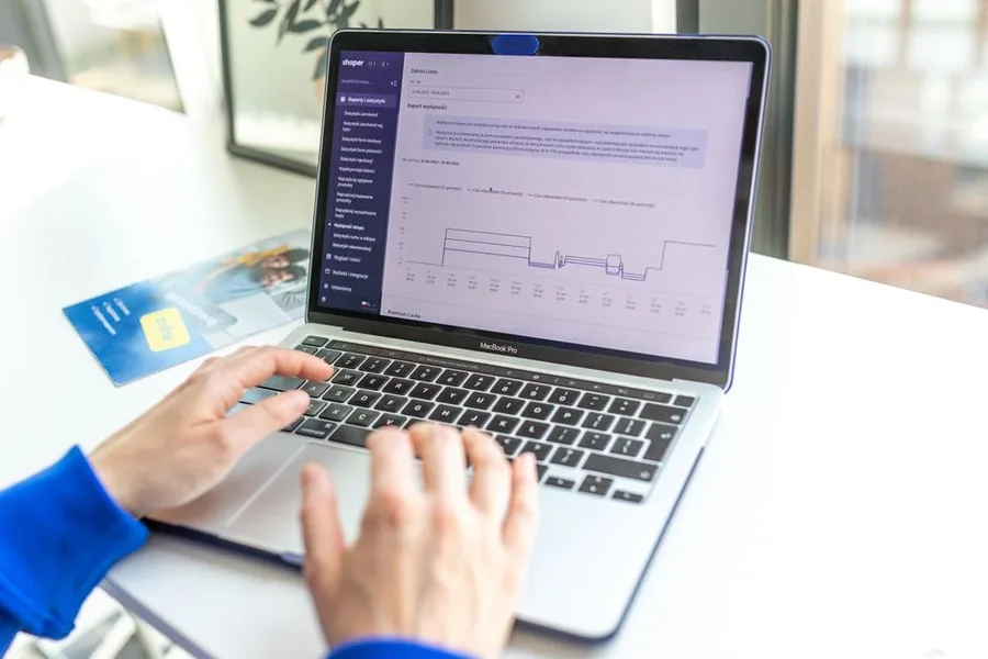 An online retailer reviewing sales and performance reports on a laptop before reconciling figures for HMRC An online retailer reviewing sales and performance reports on a laptop before reconciling figures for HMRC