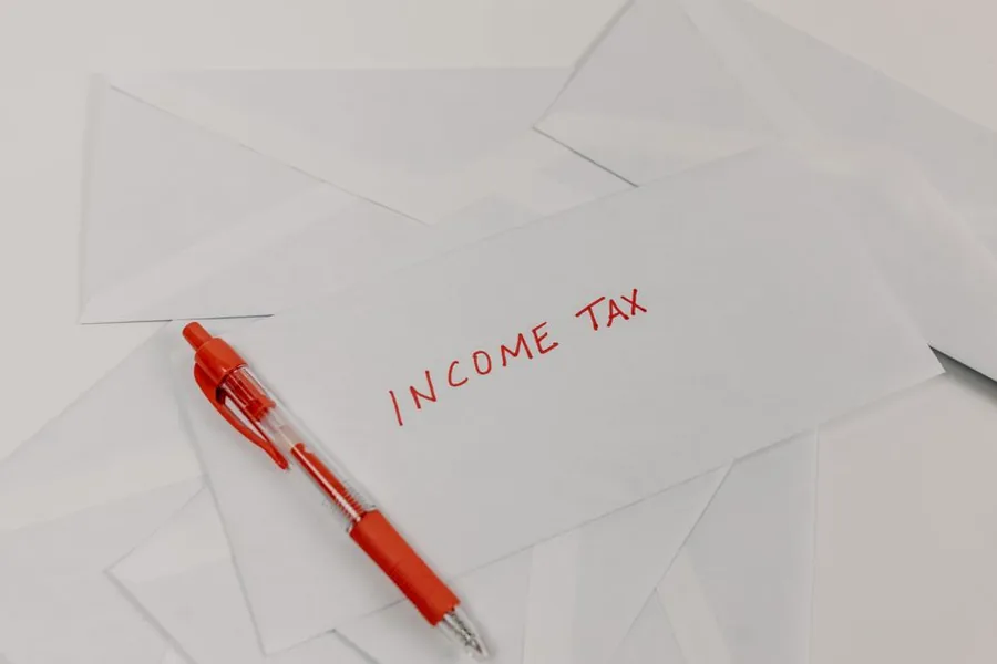 A plain envelope marked income tax in red ink, the kind of demand fiscal drag quietly pushes more earners into A plain envelope marked income tax in red ink, the kind of demand fiscal drag quietly pushes more earners into