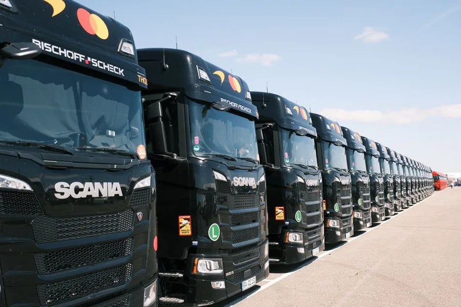 A fleet of articulated lorries lined up at a haulage depot, the kind of assets a haulage firm's accountant tracks