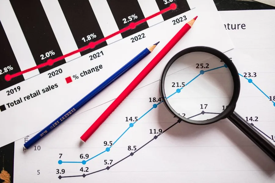 Annual retail sales figures under a magnifying glass, echoing how HMRC scrutinises marketplace seller data year on year. Annual retail sales figures under a magnifying glass, echoing how HMRC scrutinises marketplace seller data year on year.