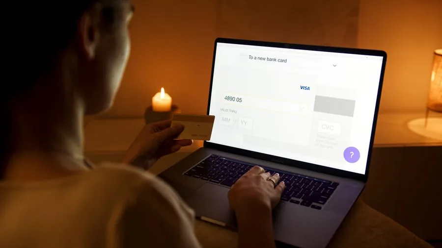 Entering debit card details on a laptop to pay a Self Assessment tax bill online to HMRC Entering debit card details on a laptop to pay a Self Assessment tax bill online to HMRC