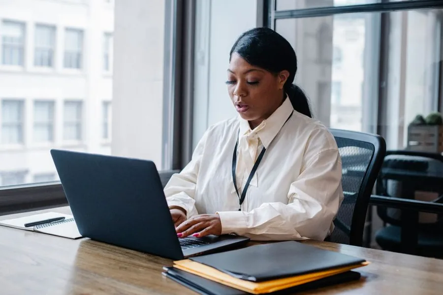A UK founder registering her new limited company online with Companies House from her office laptop A UK founder registering her new limited company online with Companies House from her office laptop